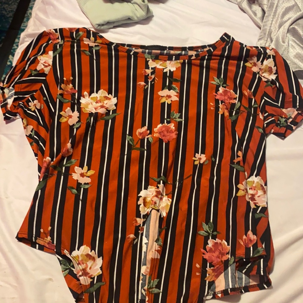 Red,black, and white with flowers shirt.